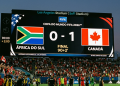 Canadá vence África do Sul com gol nos acréscimos e vai às oitavas do Mundial